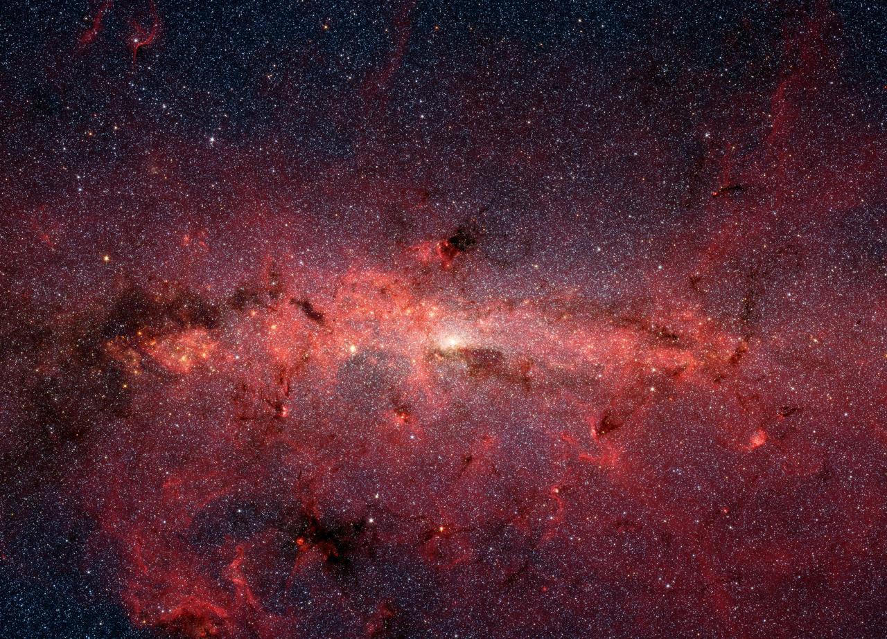 A picture of a cluster of stars at the center of the milky way taken in infared.